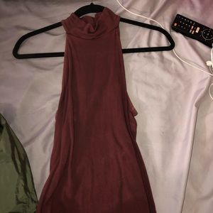 Burgundy sleeveless top.